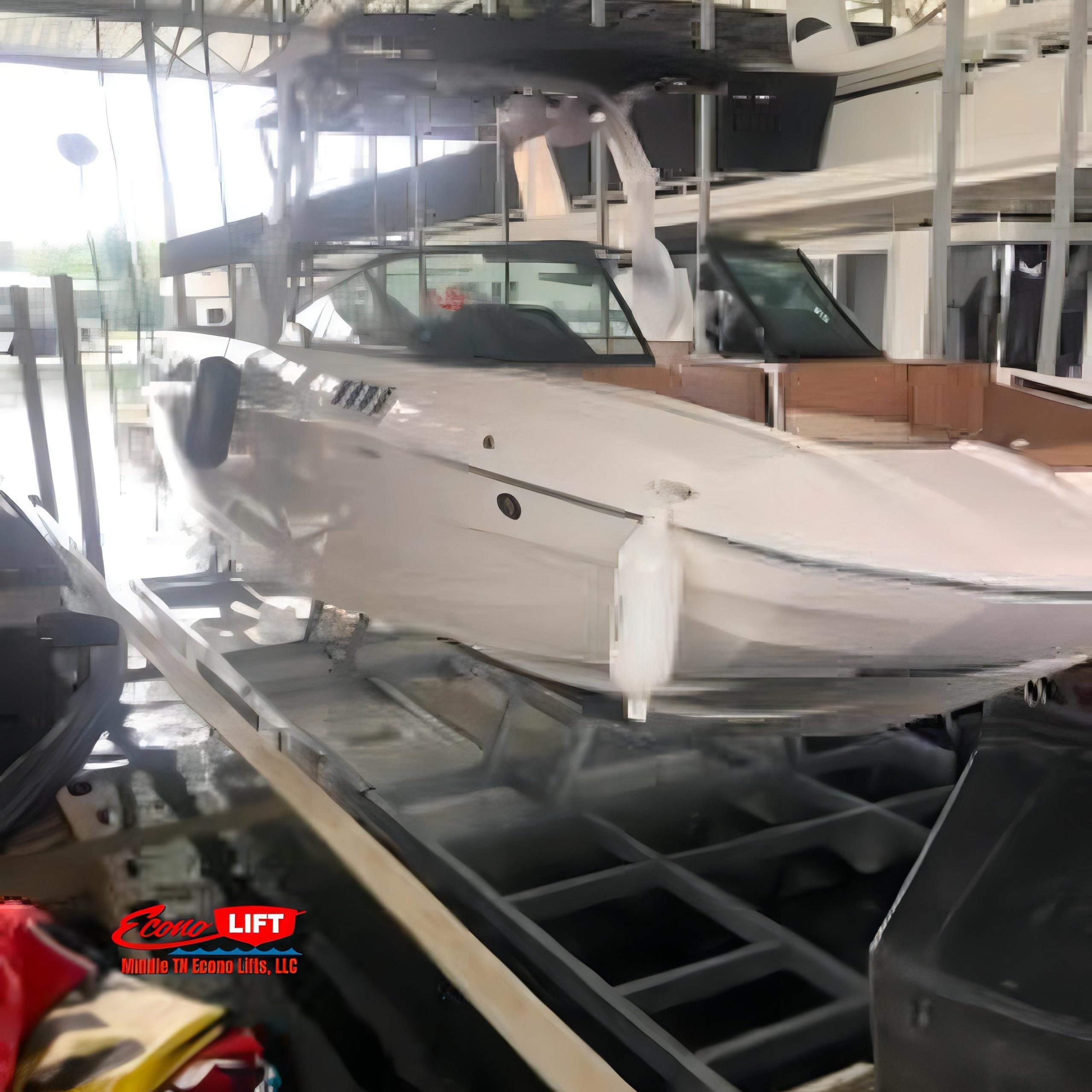 A side view of a white and blue sporty boat elevated on a Middle TN Econo Lifts 6500lb boat lift.